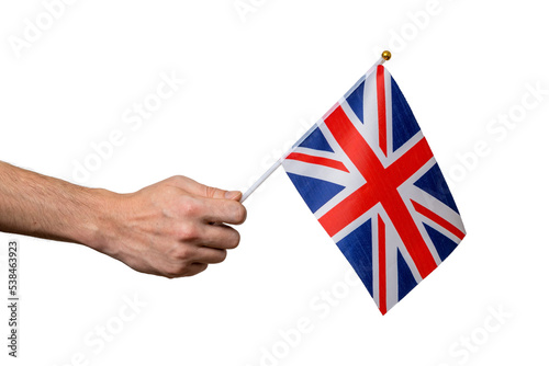 Tourist is holding flag of Great Britain in hand. Isolated on tr photo