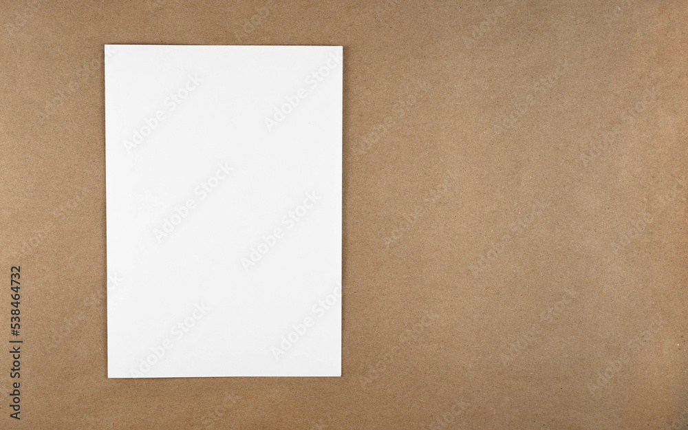A notebook in a minimal style top view isolated on brown background of recycled craft vintage paper