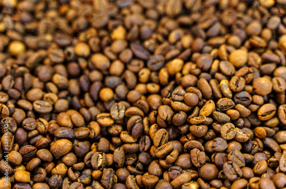 Solid background of coffee beans. Top view, close-up. Solid background of coffee beans. Top view, close-up.