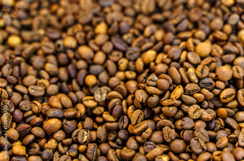 Solid background of coffee beans. Top view, close-up.