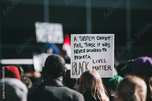 Sign saying black lives matter surrounded by a crowd in Alberta photo