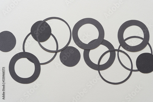 gray paper dots, circle, and ring shapes on blank paer photo