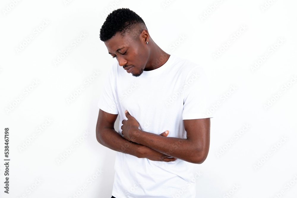 MODEL suffering from strong stomachache. MODEL suffering from strong stomachache.