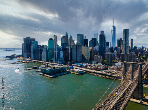 Panoramic aerial view cityscape Manhattan along East river over beautiful Brooklyn Bridge New York City, U.S. © ungvar