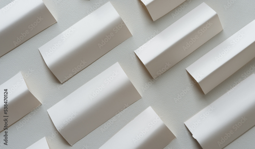 background with small cards folded and arranged on blank paper background with small cards folded and arranged on blank paper
