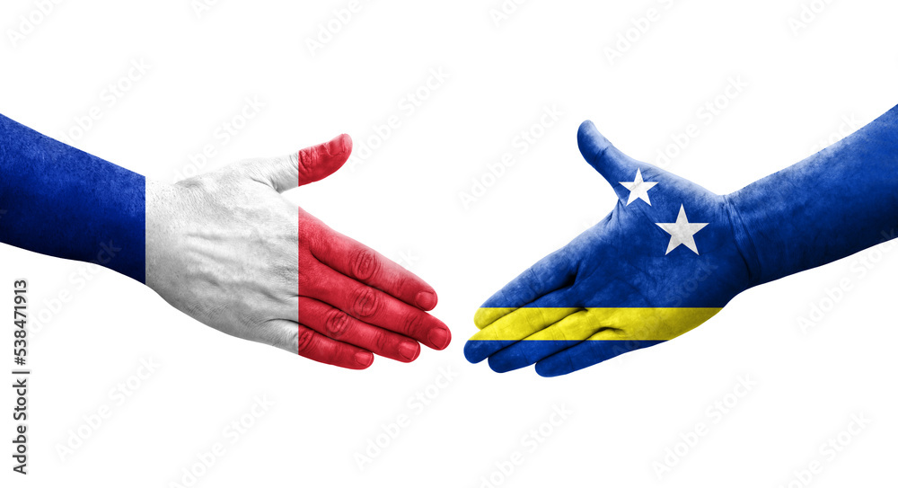 Handshake between Curacao and France flags painted on hands, isolated transparent image. Handshake between Curacao and France flags painted on hands, isolated transparent image.