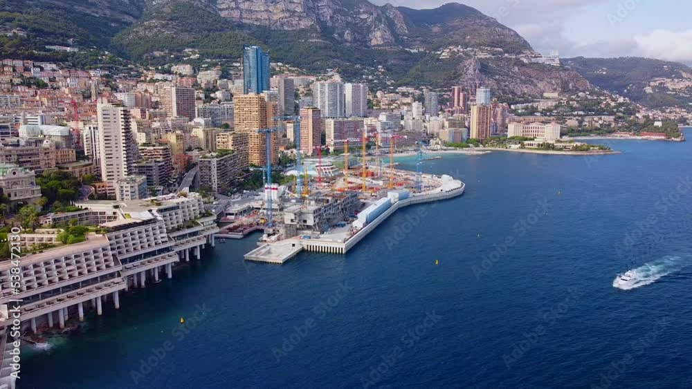Aerial view of the old casino. area with palm trees. Luxurious super cars in front of the hotel. Monument and fountain. Modern architecture of the kingdom of MONTE CARLO, MONACO Aerial view of the old casino. area with palm trees. Luxurious super cars in front of the hotel. Monument and fountain. Modern architecture of the kingdom of MONTE CARLO, MONACO