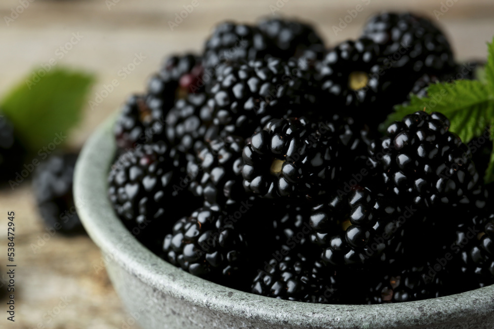 Bowl with fresh ripe blackberries on table, closeup Bowl with fresh ripe blackberries on table, closeup
