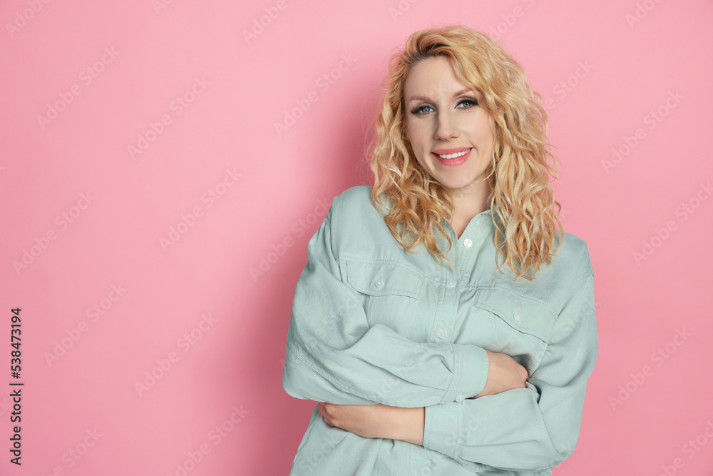 Portrait of beautiful young woman on pink background. Space for text Portrait of beautiful young woman on pink background. Space for text