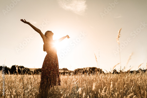 Happy woman feeling free and joyful in nature.  photo