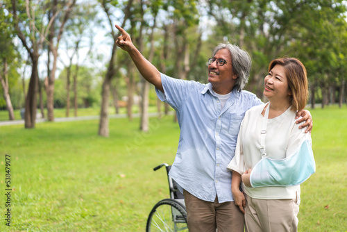 Romantic family sweet happy love senior asian couple having fun and smiling.Happy asian elderly man husband and wife hug together in park at home.insurance concept © Art_Photo