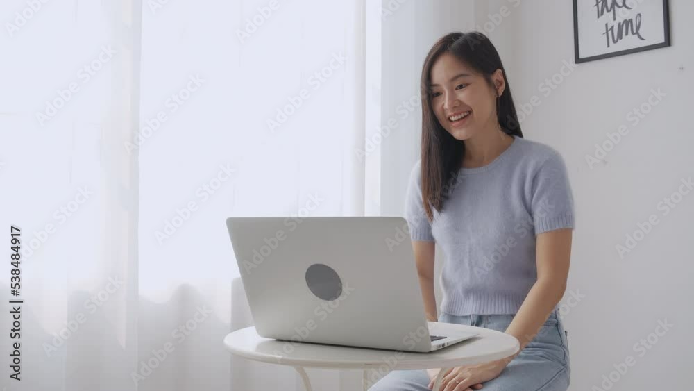 Young asian woman using laptop computer for video conference online with friends, businesswoman working with video call for meeting with social network, business and communication concept. Young asian woman using laptop computer for video conference online with friends, businesswoman working with video call for meeting with social network, business and communication concept.