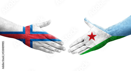 Handshake between Djibouti and Faroe Islands flags painted on hands  isolated transparent image.