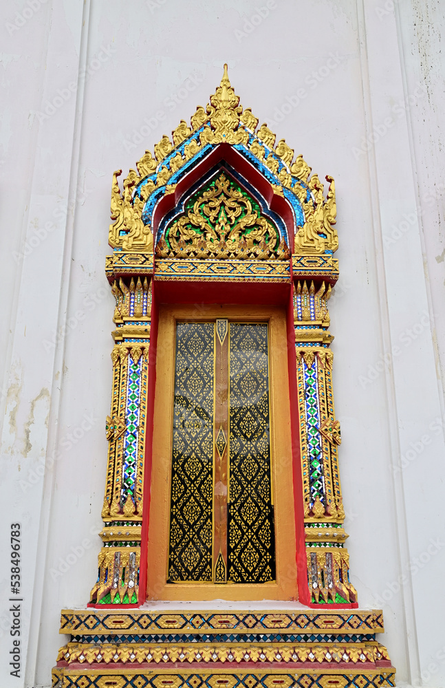 Fototapeta premium BANGKOK, THAILAND - October 13, 2022 : Golden Wood craft Thai classic pattern in temple at Bangkok, Thailand.