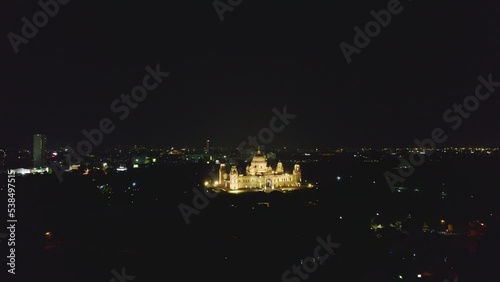 Aerial view of The Victoria Memorial during night, a large marble building in Central Kolkata, West Bengal, India photo