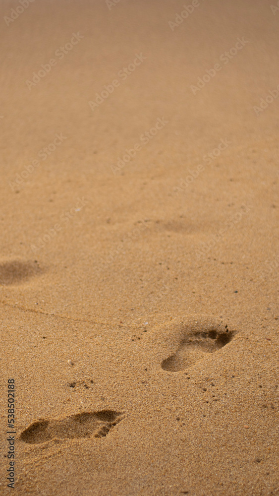 A picture of a footprints on the sand, symbolizing the memories the you leave behind in the journey of life A picture of a footprints on the sand, symbolizing the memories the you leave behind in the journey of life