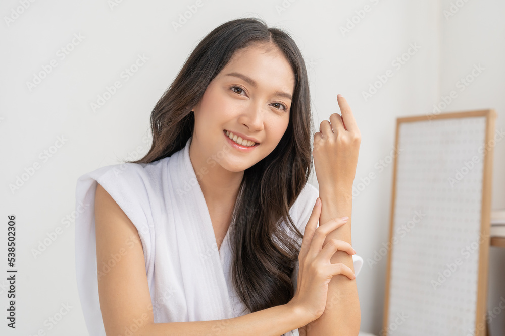 Beauty, beautiful asian young woman, girl wearing bathrobe, looking at camera, long hair with clean fresh skin. Cosmetology of face care, facial spa treatment. People look with natural fashion style. Beauty, beautiful asian young woman, girl wearing bathrobe, looking at camera, long hair with clean fresh skin. Cosmetology of face care, facial spa treatment. People look with natural fashion style.