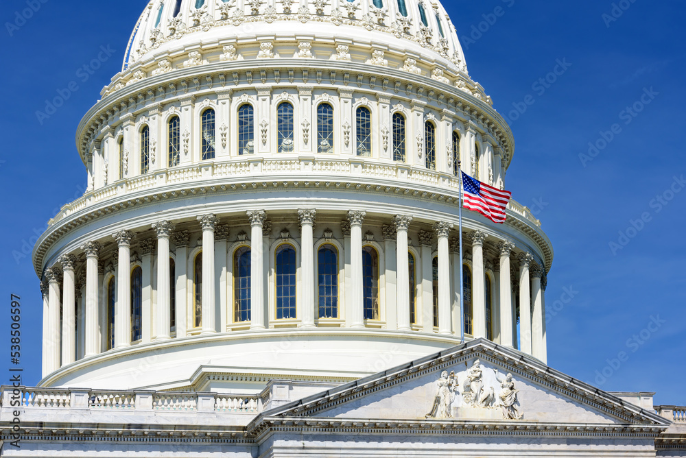 Close up of US Capitol Building dome with the American flag, Washington DC, USA