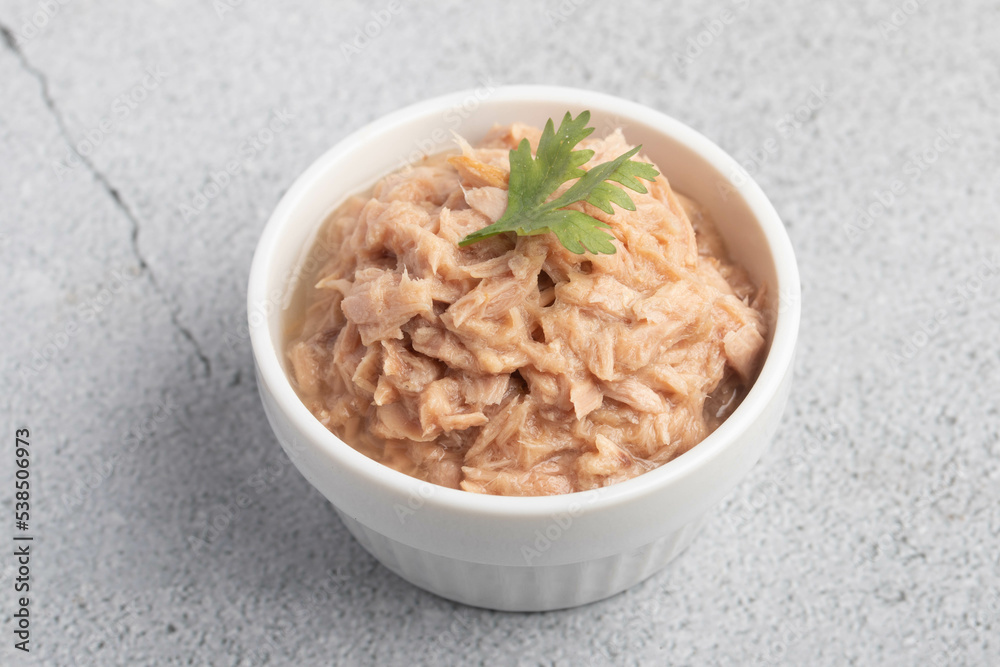 canned tuna in a white cup on a white background canned tuna in a white cup on a white background
