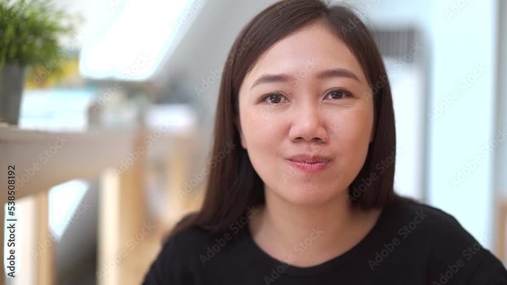 Happy - cheerful Asian woman enjoy eating spaghetti carbonara ham and bacon in the Italian restaurant. 