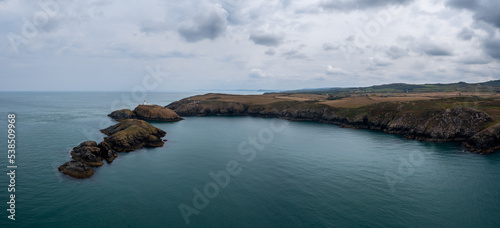 panorama landscape of the Pembrokeshire coast with the historic Strumble Head Lighthouse photo