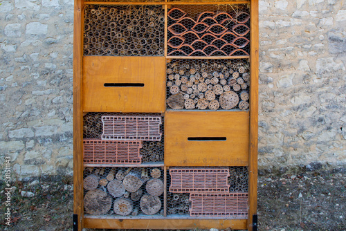 insect hut hotel french text in wooden house for butterfly bee and animals