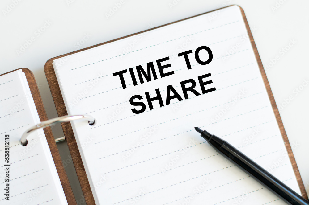 Time to Share open notebook with text on the table Time to Share open notebook with text on the table
