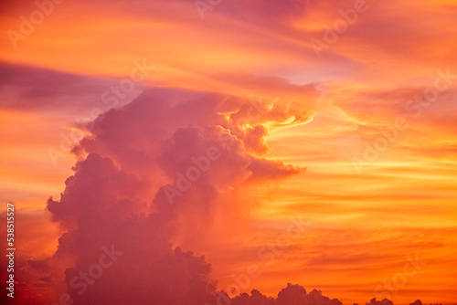 Surreal Serenity: Floating with Grace in the Abstract Orange Cloudscape