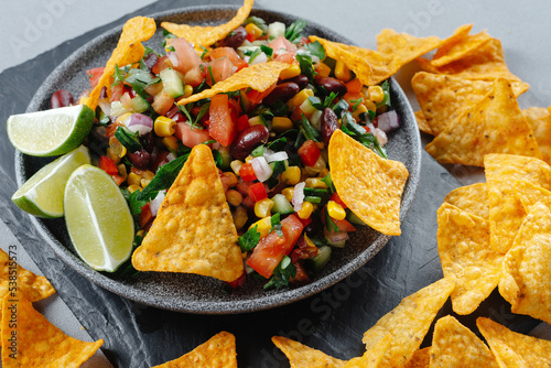 Texas Dish. Cuisine of the United States. Vegetarian Texas caviar with chips and nachos. Reducetarian, flexitarian, pescatarian eating. Top view