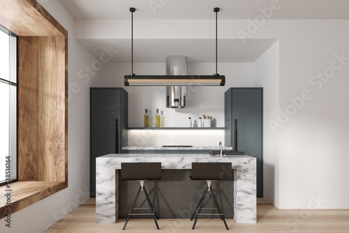 Stylish kitchen interior with bar countertop and seats, panoramic window