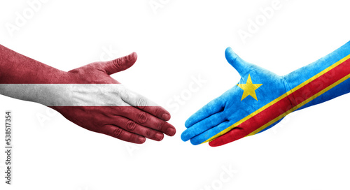 Handshake between Dr Congo and Latvia flags painted on hands, isolated transparent image.