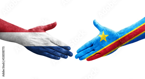 Handshake between Dr Congo and Netherlands flags painted on hands, isolated transparent image.
