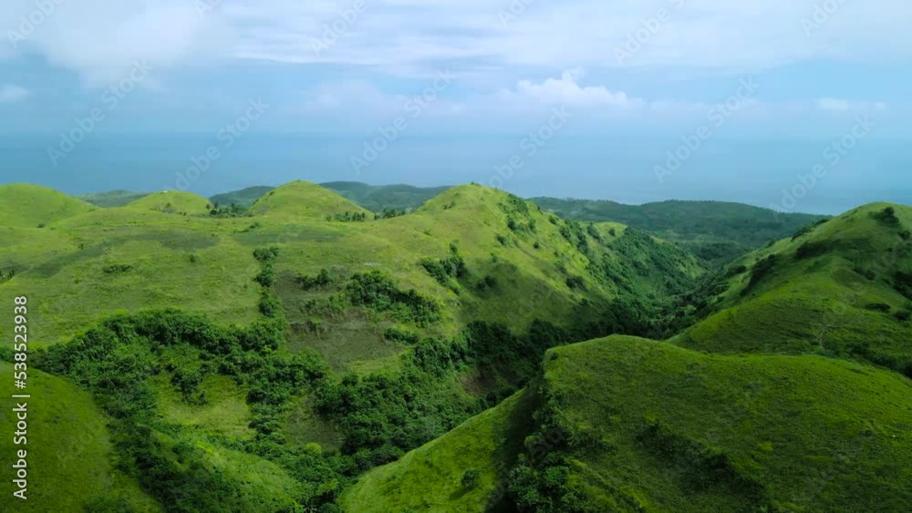landscape with green hills and clouds and sky, Nusa Penida Hills, Teletubbies Hill, Bali, Aerial Shot, Indonesia landscape with green hills and clouds and sky, Nusa Penida Hills, Teletubbies Hill, Bali, Aerial Shot, Indonesia