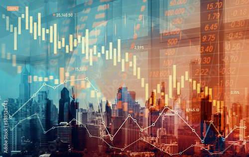 Economic crisis concept shown by declining graphs and digital indicators overlap modernistic city background. Double exposure.