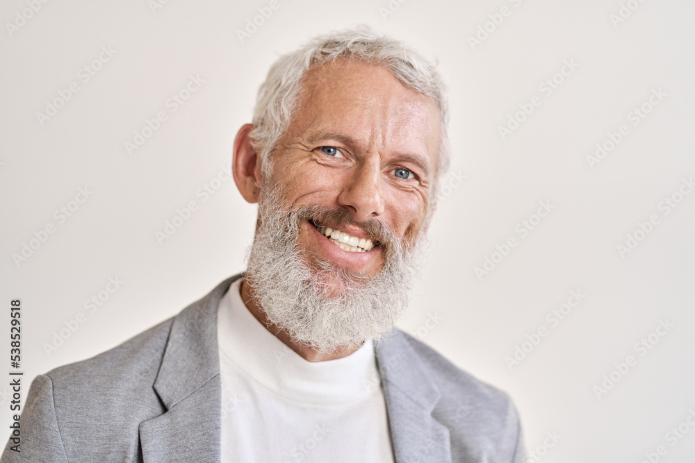 Happy mature older bearded business man leader executive, smiling middle aged old senior confident professional businessman teacher wearing suit standing isolated on white wall, headshot portrait. Happy mature older bearded business man leader executive, smiling middle aged old senior confident professional businessman teacher wearing suit standing isolated on white wall, headshot portrait.