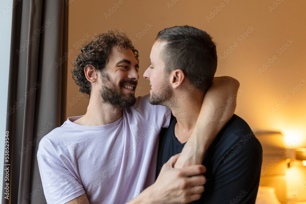 Obraz premium Portrait of Carefree Gay Couple Indoors. Happy gay couple spending time together
