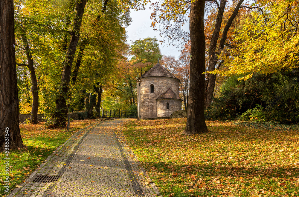 Autumn colored trees and the Rotunda of St. Nicholas and St. Wenceslas on Castle Hill on a sunny day