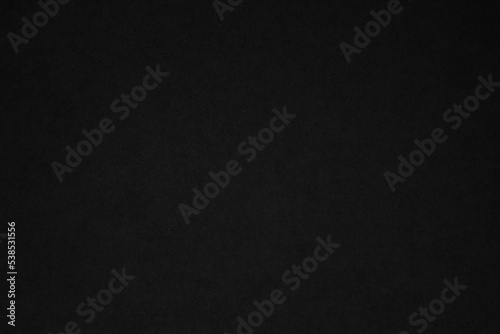 Black paper texture background. Black blank cardboard sheet page. Old vintage page dark grunge vignette. Pattern rough art rustic grunge letter. Material cardboard.