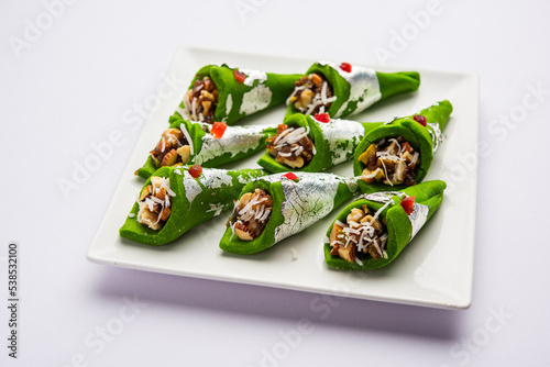 Kaju Gulkand Paan Mithai barfi - Indian sweet or dessert served in a plate