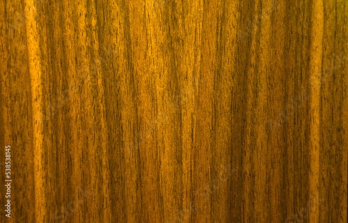 Lacquered wooden background.Photo of a wood texture covered with varnish in the style of the 80s. Lacquered furniture surface. Varnish the wooden countertop.