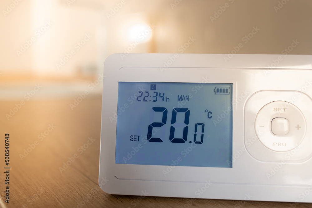 Programmable heating control panel in living room Programmable heating control panel in living room
