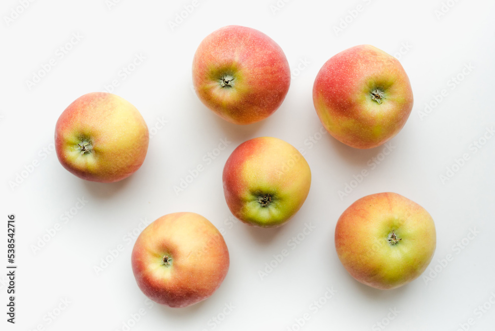 Red apples on a white background. Texture with apples. Red apples on a white background. Texture with apples.