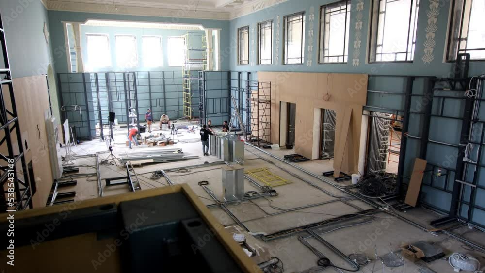 Timelapse of walls decoration and equipment installation in electronic store during days. Professional building and construction works