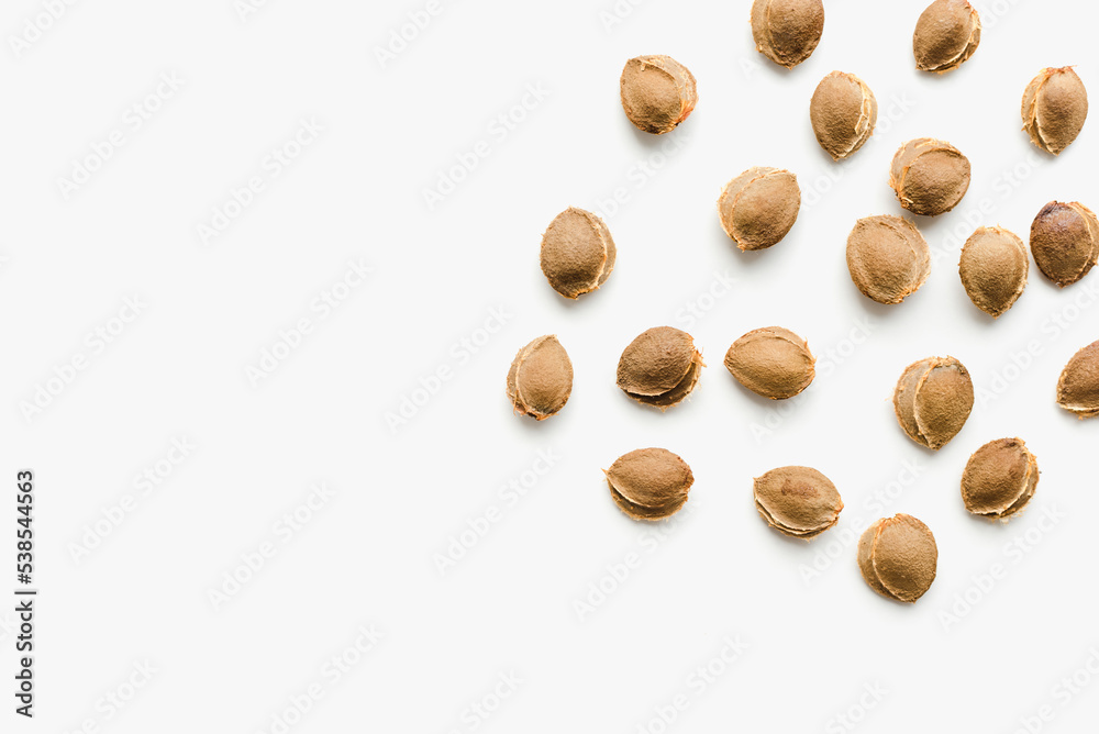 Apricot kernels on a white background. Apricot kernels. Apricot kernels on a white background. Apricot kernels.