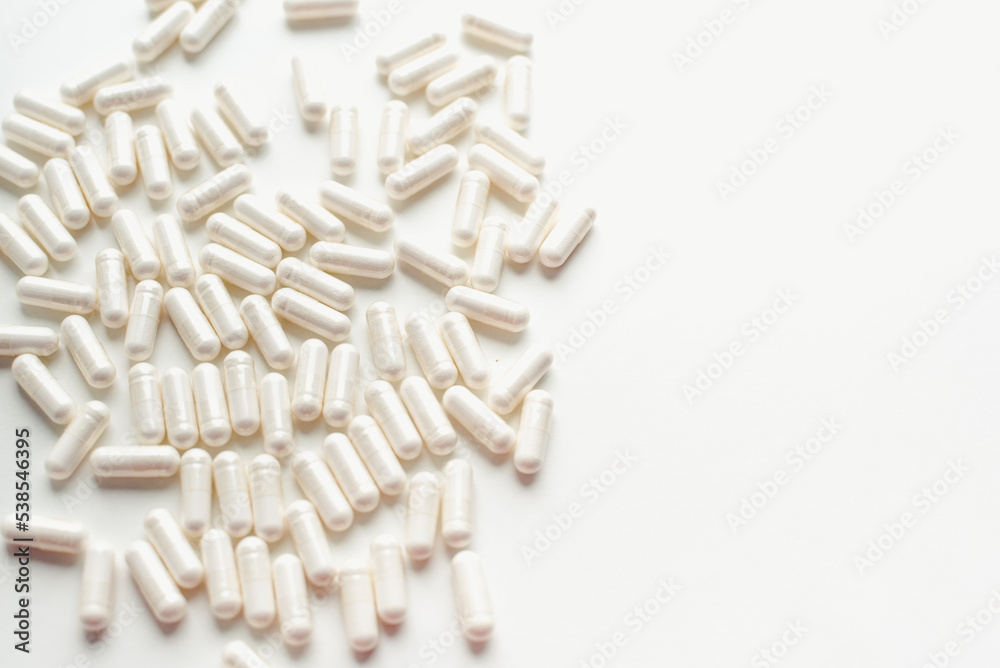 Pills on a white background. Tablets in capsules. Vitamins in capsules. Pills on a white background. Tablets in capsules. Vitamins in capsules.