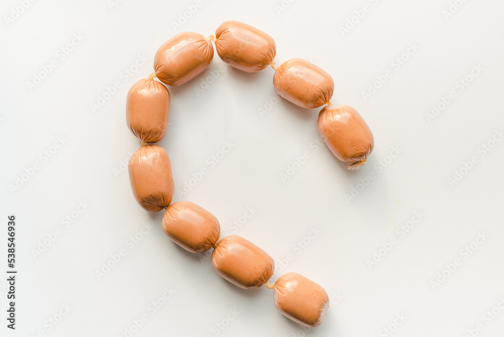 Sausages on a white background. Sausages on a white background. Sausages on a white background. Sausages on a white background.