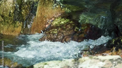 clear river water flowing over the rocks, close-up 2