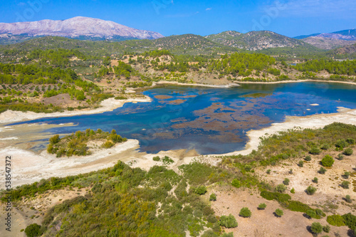 Fototapeta Naklejka Na Ścianę i Meble -  Aerial view of Gadouras Dam. Solving the important and crucial water supply problems.
Near the villages of Lardos and Laerma in the southern part of the island. Rhodes, Greece.