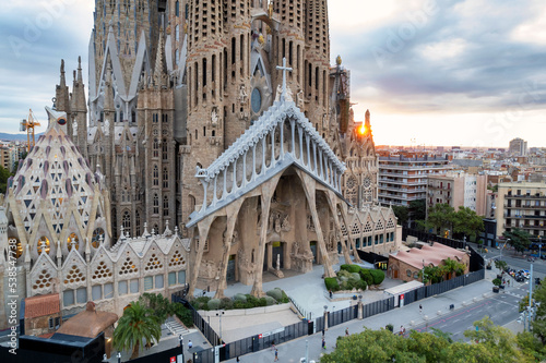Sunrise drone aerial of the Basilica Sagrada Familia, the iconic church has been in construction for over a century but is scheduled for completion in 2026. © Allen.G