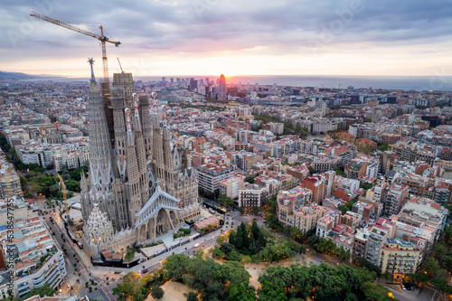 Sunrise drone aerial of the Basilica Sagrada Familia, the iconic church has been in construction for over a century but is scheduled for completion in 2026.